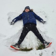 George making a snow angel